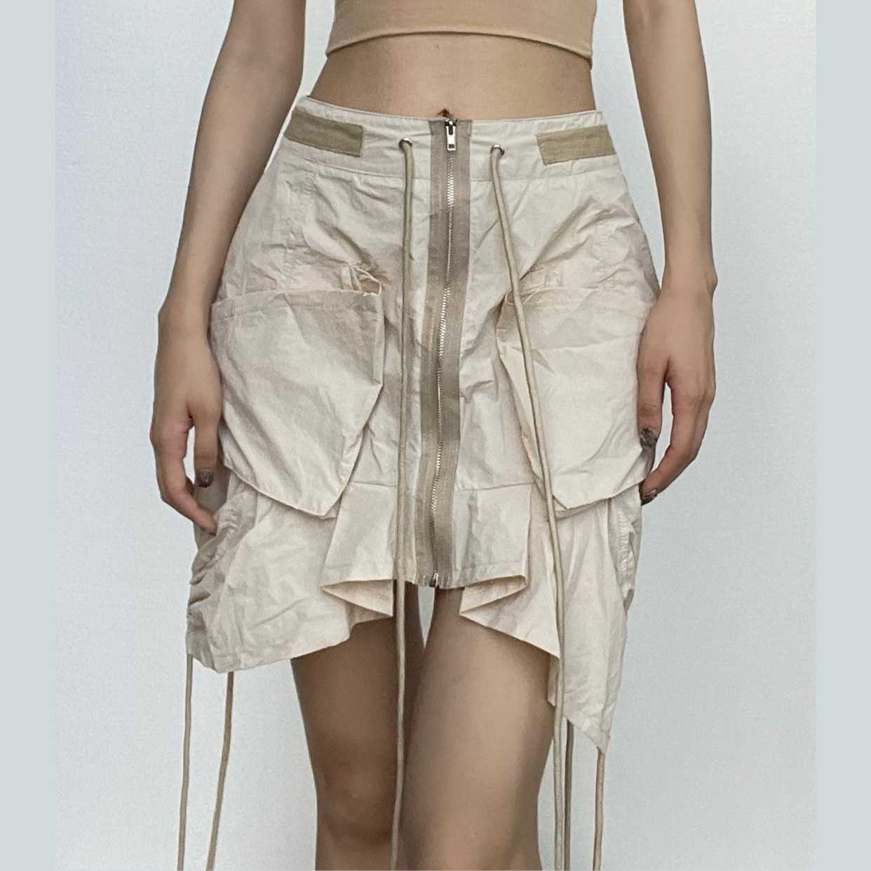 Rrawstring zip-up irregular cargo pocket mini skirt